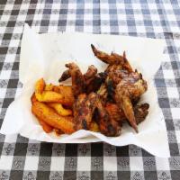 Jerk Chicken Wings Lunch · Mild or spicy. Served with 2 side dishes and a corn muffin.