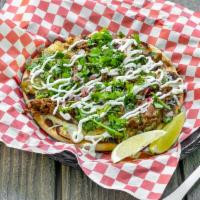 Mexican Pizza · Toasted pita bread, jack cheese, meat of choice, cilantro, onions and salsa.