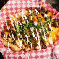 Asada Fries · Fries, cheese, meat, sour cream, salsa, cilantro, onions.