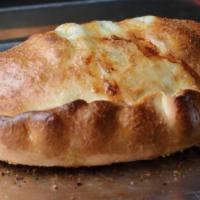 Mozzarella and Ricotta Calzone · Additional topping for an additional charge.