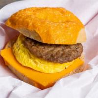 8. Sausage, Egg and Cheese Bagel · Egg with a sausage patty, cheddar cheese, salt and pepper.