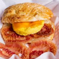 12. Bacon, Egg and Cheese Croissant · Egg with bacon, cheddar cheese, salt and pepper on a croissant.