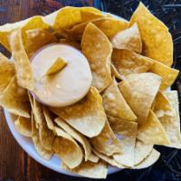 Chips & Queso · Corn Tortilla chips + house made 