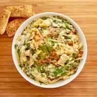 Spinach Artichoke Dip · Made daily in house with fresh spinach, artichoke hearts, a variety of cheeses including our...