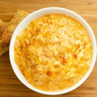 Buffalo Chicken Dip · Spice up your night! Try our signature Buffalo Chicken Dip made with tender chicken, buffalo...