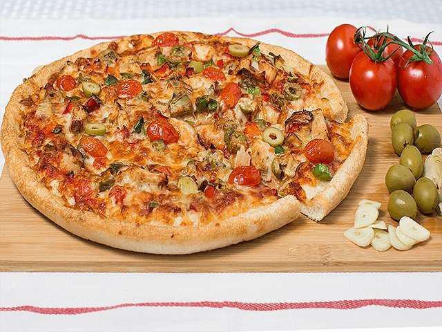 Vegan Tuscany · Vegan Al Dente pizza sauce • Diced Tomatoes • Green Peppers • Red Peppers • Fresh Garlic • Artichoke Hearts • Daiya Mozzarella Cheese