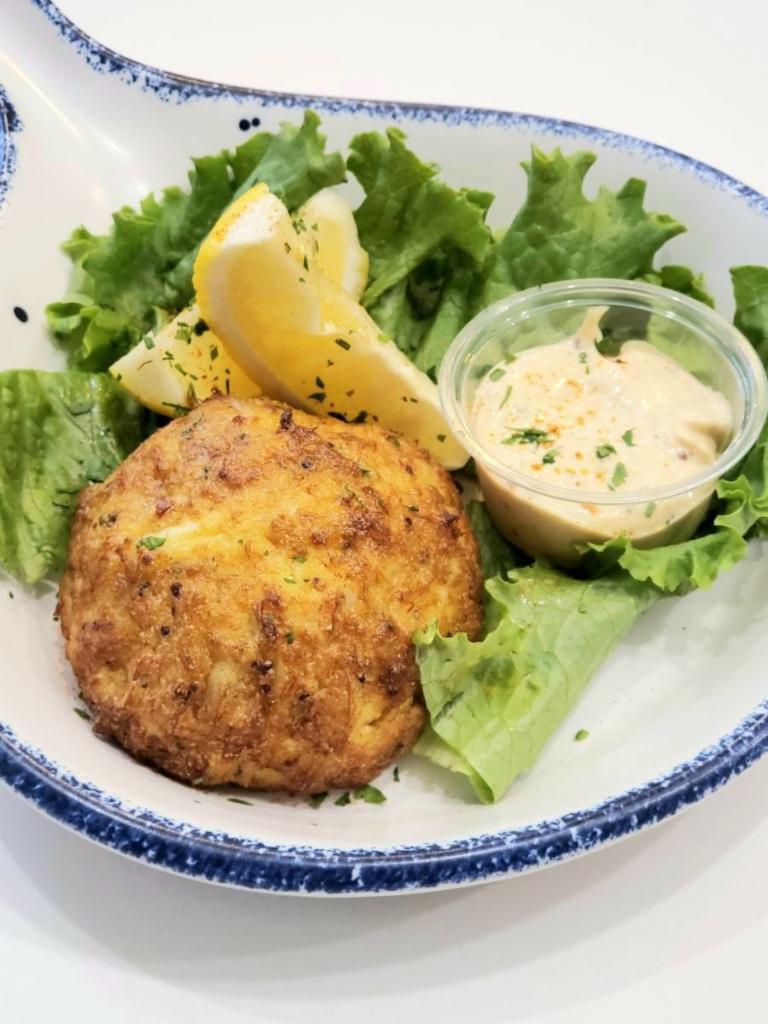 Crab Cakes · 1 or 2 crab cakes served with lemons and a side of our house made crab sauce.

