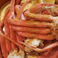 Regular Snow Crab Legs · Steamed snow crab legs served by the pound. Served with a lemon, garlic seasoned butter. Rou...