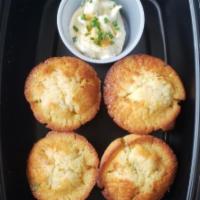 Honey Jalapeno Cornbread · 4 pieces of honey, jalapeno cornbread. Served with a chive honey butter.