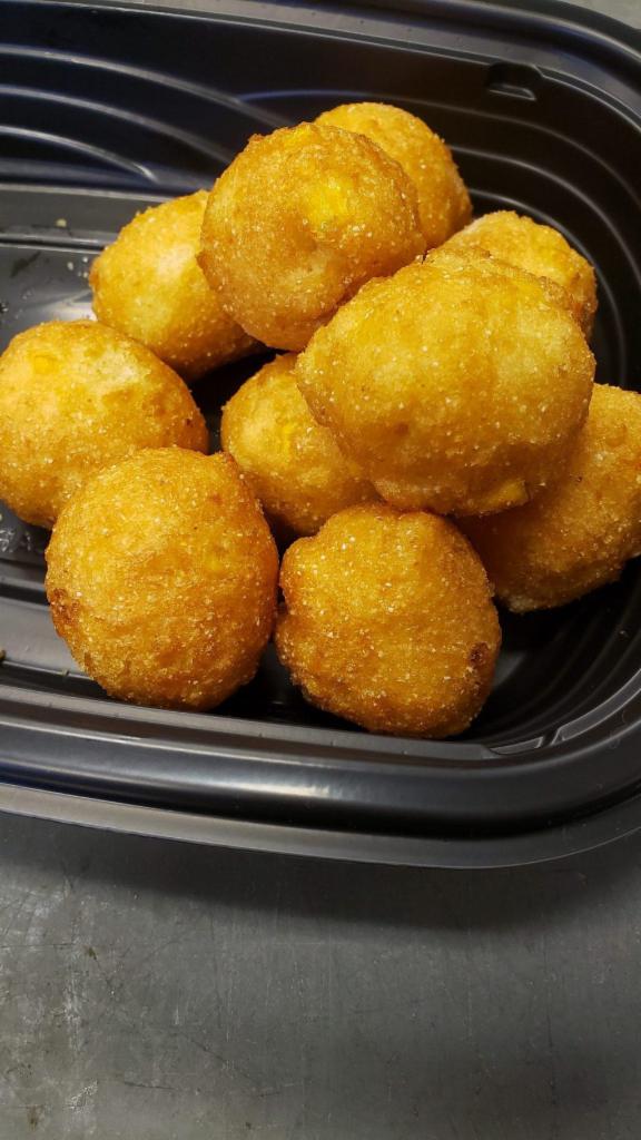 Hushpuppies · Hushpuppies air fried and served with our lemon garlic butter.