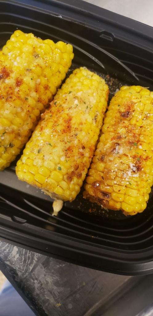 Cajun Lime Corn · Grilled in a  Cajun lime butter. Topped with a chilli, lime salt and served with a lime.