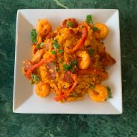 Paella Caribena · Chicken, shrimp, sausage sauteed with peppers, onions and spice mixed with Spanish rice.