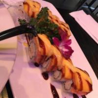 Mango-Tango Roll · In: shrimp tempura, crab meat.
Out: salmon, mango, eel sauce, mango sauce.