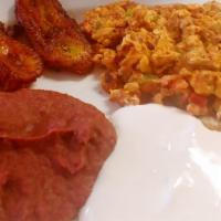 Huevos con Chorizo Breakfast · 2 scrambled eggs mixed with sausage, tomatoes, and onions. Served with cream, refried beans,...