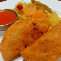 Pastelitos de Carne · Each. Fried Stuffed seasoned corn tortilla with ground beef and vegetables. Serve with cabba...