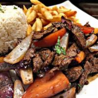 Lomo Saltado · Beef, tomato, onion sautéed in a fiery wok with french fries and white rice.