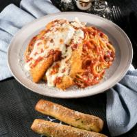 Chicken Parmigiana · Breaded chicken breast, mozzarella cheese and marinara sauce over a bed of spaghetti. Served...