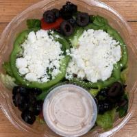 12. Greek Salad · Lettuce, feta, tomatoes, cucumbers, onions, green peppers, Greek dressing.