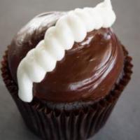 Chocolate Cream Cupcake · Chocolate cake filled with buttercream, topped with fudge icing and buttercream