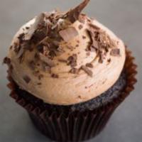 Choco-holic Cupcake · Chocolate cake with chocolate buttercream topped with chocolate curls.
