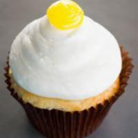 Lemon Drop Cupcake · Vanilla bean cake filled with lemon topped with lemon buttercream and lemon dollop.