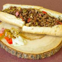 Steak Bomb Sub · In House Hand Shaved Skirt Steak, Grilled and Chopped Fine, w/Peppers, Mushrooms, Onions, Sa...