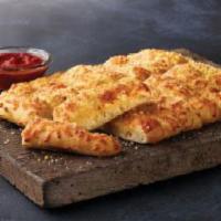 CheezyBread · 16 pieces. Fresh-baked bread strips with our three-cheese blend and garlic butter, served wi...
