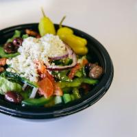 Greek Salad · Romaine spring mix, cucumbers, tomatoes, bell peppers, red onions, Kalamata olives and feta ...