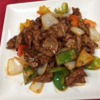 Pepper Steak with Onions · Flank beef steak with onions and bell peppers.