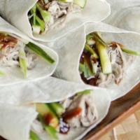 Moo Shu · 4 pieces. Stir-fried vegetables, eggs, and protein. Served with thin wraps.