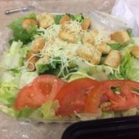 Caesar Salad · Romaine lettuce with caesar dressing topped with shredded parmesan and croutons.