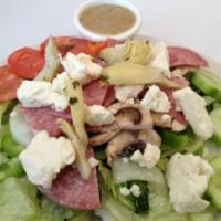 Greek Salad · Lettuce, onion, bell pepper, black olives, mushroom, tomatoes, cucumber, artichoke hearts, s...