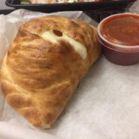 Meat Lover Calzone · Pepperoni, sausage, meatball, Canadian bacon, salami, ricotta, mozzarella and parmesan cheese.
