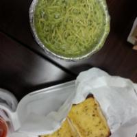 Pesto Pasta · Angel hair pasta with chicken breast and Sun dried tomatoes in a pesto sauce.