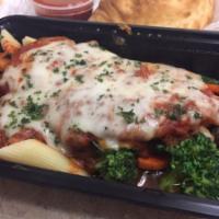 Chicken Parmesan · Chicken breast baked with mozzarella served with penne marinara and sauteed vegetables.
