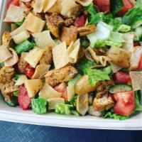 Fattoush Salad · Romaine lettuce, cucumbers, tomatoes, and pita chips with dressing.