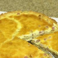 Quiche Lorraine · French Tart baked in a pastry crust, bacon, cheese, eggs, and sour cream served with side sa...