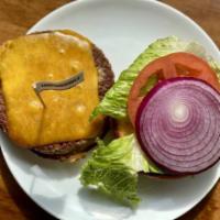 Impossible Veggie Burger · Plant Based Burger topped with Lettuce, Tomato, Onion, Cheddar Cheese, and our Special House...