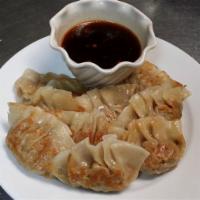 8. Pan Fried Dumpling · 12 pieces. Comes with a dumpling sauce.

