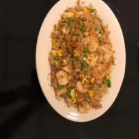 Chaulafan · Fried rice mixed with chicken, shrimp, eggs, beef, pork, green peas, and carrots.