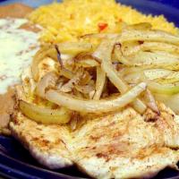 Pollo Asado · Chicken breast topped with grilled onions. Served with rice, beans refried or black, and tor...