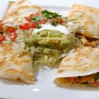 Quesadilla Ranchera · Choice of chicken or steak, mixed with bell peppers, onions, tomatoes, and cheese. Served in...