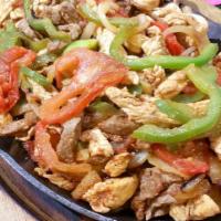 Mixed Fajitas · Grilled tender sliced beef and chicken, with bell peppers, onions, tomatoes all mixed. With ...