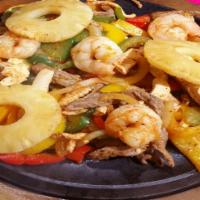 Fajita Tropical · Chicken, shrimp, steak, pineapple, mixed peppers, onions, and tomatoes. Corn or flour tortil...