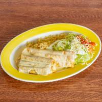 Grilled Chimichanga · Grilled onions, tomatoes, and bell peppers, wrapped in a flour tortilla deep-fried, and topp...