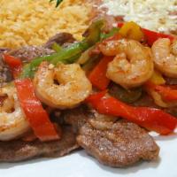 Steak and Shrimp · Rib-eye steak, grilled shrimp, bell peppers, tomatoes, and onions on top. Served with rice, ...