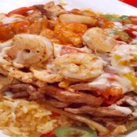 El Loro Lindo · Grilled steak, chicken, and shrimp, mixed bell peppers, tomatoes, and onions. Served with ri...