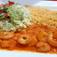 Camarones A la Diabla · Marinated shrimp in hot spicy sauce. Served with rice, lettuce, guacamole, tomatoes, and tor...