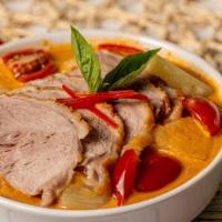 Duck Curry · Duck, tomatoes, pineapple, bell peppers and thai basil in red curry sauce.