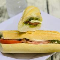 Le Caprese Sandwich plus a Drink · Vine-ripened tomatoes, fresh mozzarella cheese and a drizzle of pesto served on our French b...